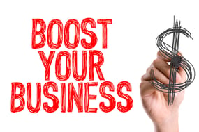 Hand with marker writing Boost Your Business-2